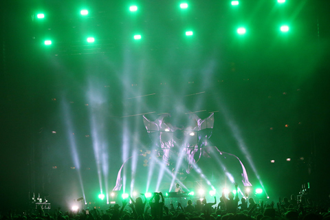 Production designer Rob Sinclair crafted the scenic elements of neon-lit glass cubes