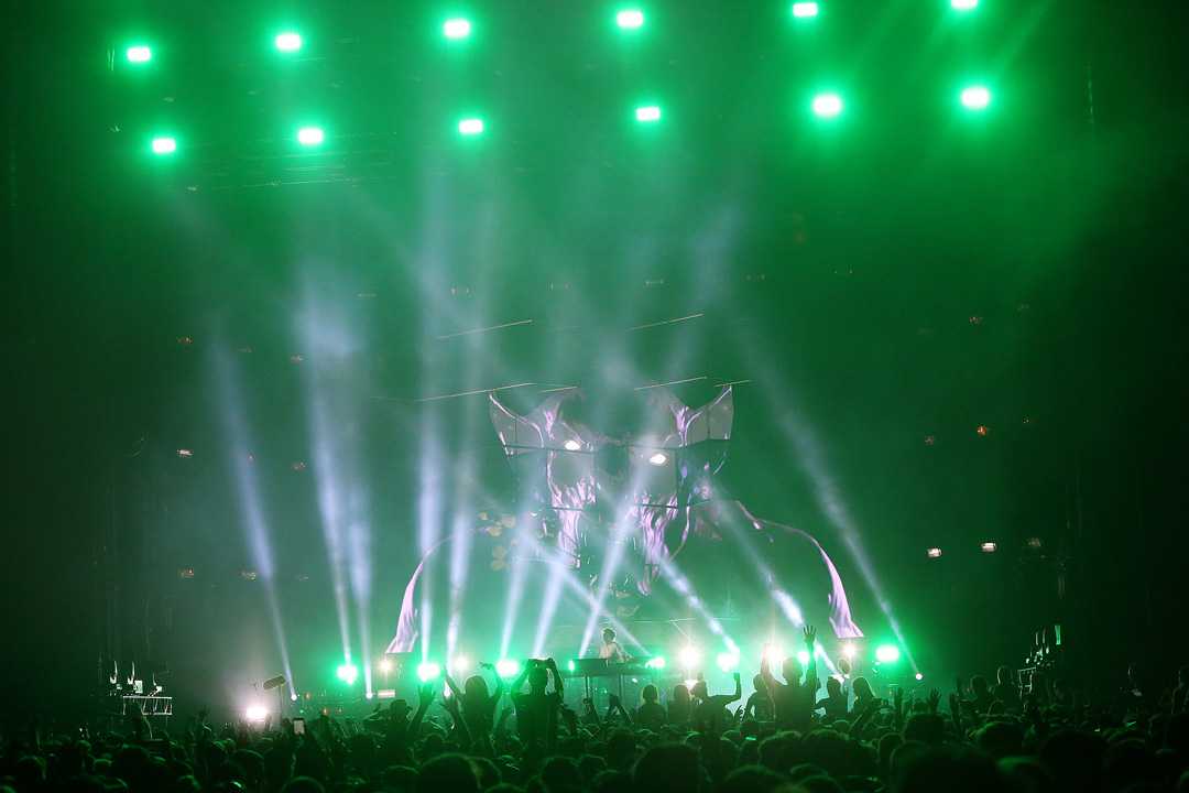 Production designer Rob Sinclair crafted the scenic elements of neon-lit glass cubes