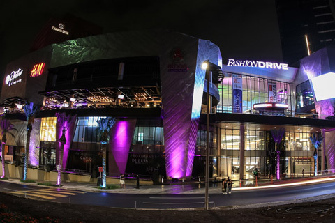 The modern shopping mall features top fashion brand stores and stretches across four levels