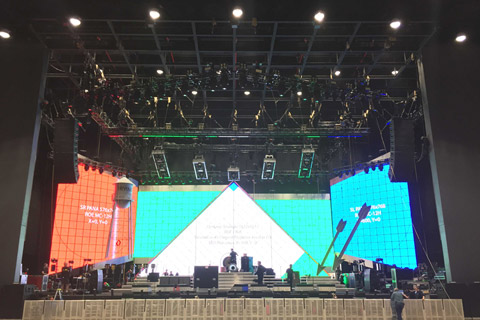 The set gives a strong Las Vegas feel consisting of large flown marquee arrows lined in neon