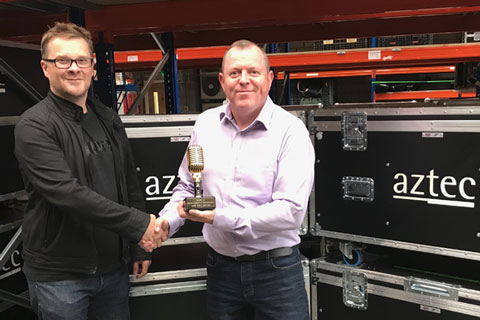 Stuart Moots of Shure hands the award to Aztec's Steve Colesell