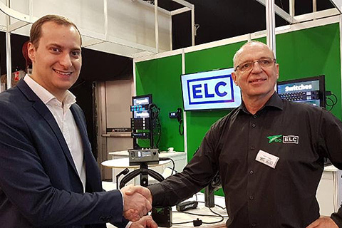 Dean Karov of MK Light Sound shakes hands on the deal with Silvio Cibien of Green-GO