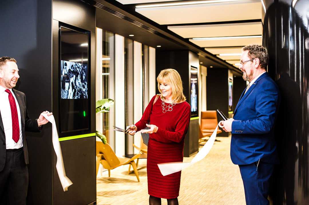 Shure Inc. CEO Christine Schyvinck cuts the ribbon