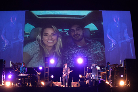 The lighting on stage was coordinated with video images on the drive-in’s giant screen