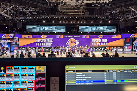 Giant wraparound LED video screens filled the void left by the lack of fans