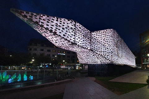 The work takes the London landmark and turns it on its side in Piccadilly Gardens