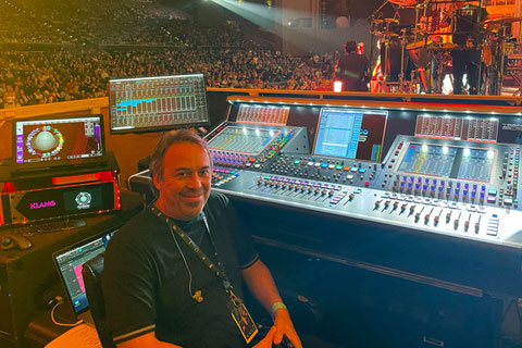 Ricky Martin’s monitor engineer, César Benítez, seated at his DiGiCo Quantum5 console