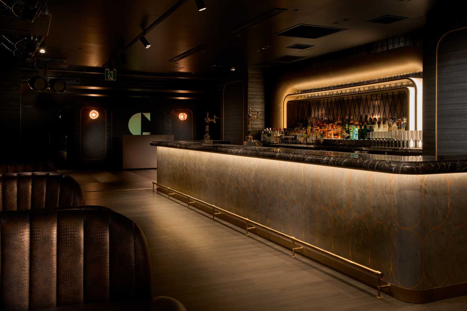 ‘Black and gold interior design contrasts with a distinct lack of pillars’